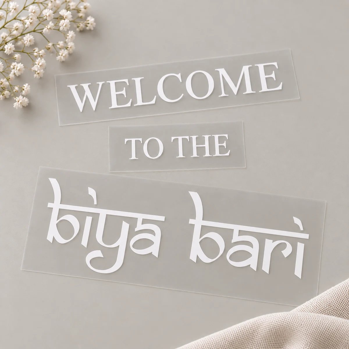 White Welcome to the Biya Bari vinyl lettering supplied in separate sections